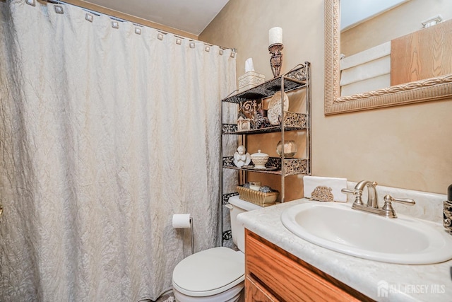 full bathroom featuring vanity and toilet