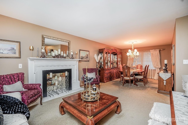 carpeted living room featuring a notable chandelier and a fireplace