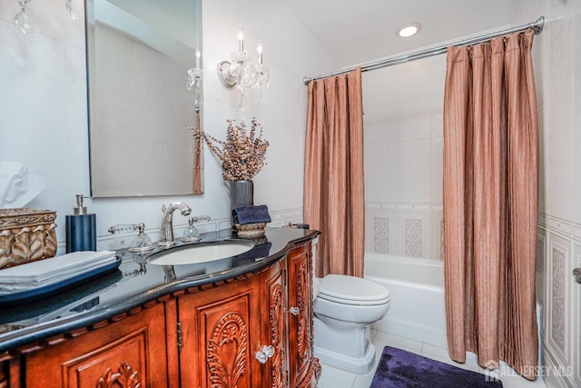 full bath featuring a notable chandelier, shower / tub combo with curtain, toilet, tile patterned flooring, and vanity