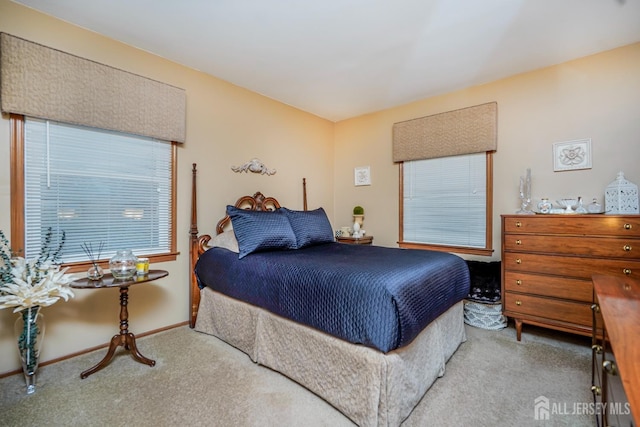 carpeted bedroom with baseboards