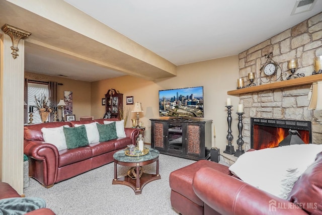 living area with a fireplace and visible vents