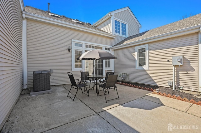 77 Winthrop Rd Unit C, Monroe Township, NJ 08331 - view of patio featuring outdoor dining area and central AC