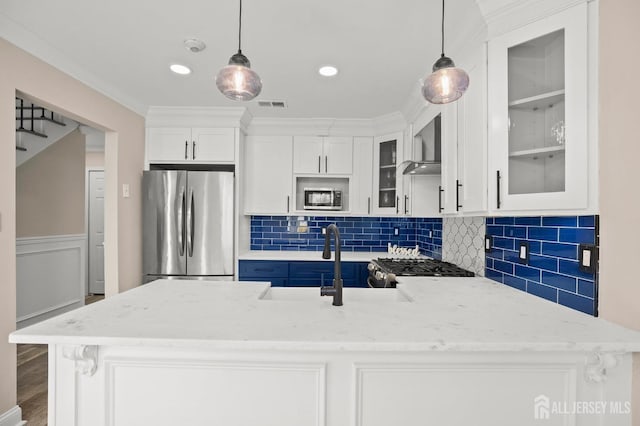 77 Winthrop Rd Unit C, Monroe Township, NJ 08331 - kitchen with visible vents, appliances with stainless steel finishes, a peninsula, glass insert cabinets, and wall chimney exhaust hood