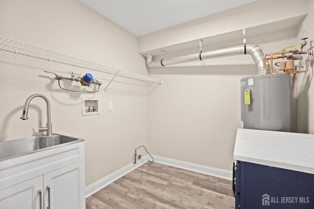 77 Winthrop Rd Unit C, Monroe Township, NJ 08331 - washroom with cabinet space, a sink, light wood finished floors, hookup for a washing machine, and water heater