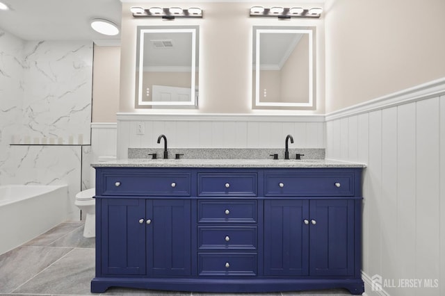 77 Winthrop Rd Unit C, Monroe Township, NJ 08331 - bathroom with visible vents, a sink, wainscoting, and double vanity