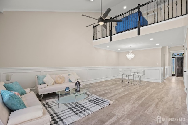 77 Winthrop Rd Unit C, Monroe Township, NJ 08331 - living area with wood finished floors, a wainscoted wall, ceiling fan with notable chandelier, ornamental molding, and recessed lighting