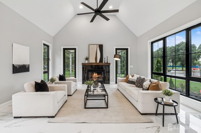 living room featuring high vaulted ceiling and ceiling fan