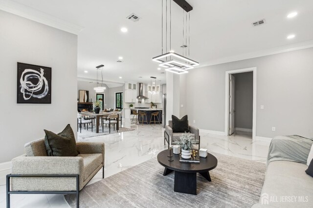 living room featuring crown molding