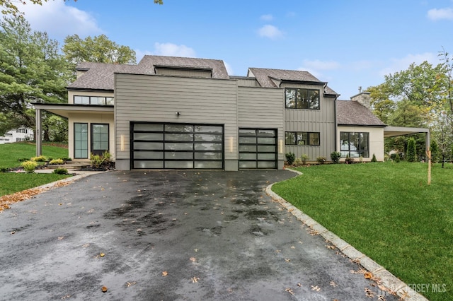 modern home with a front yard and a garage