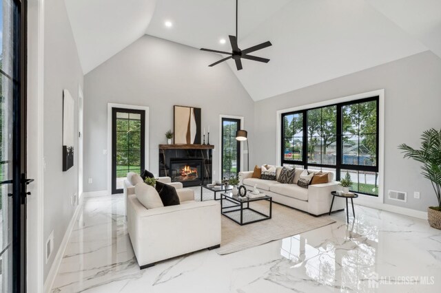 living room with high vaulted ceiling and ceiling fan