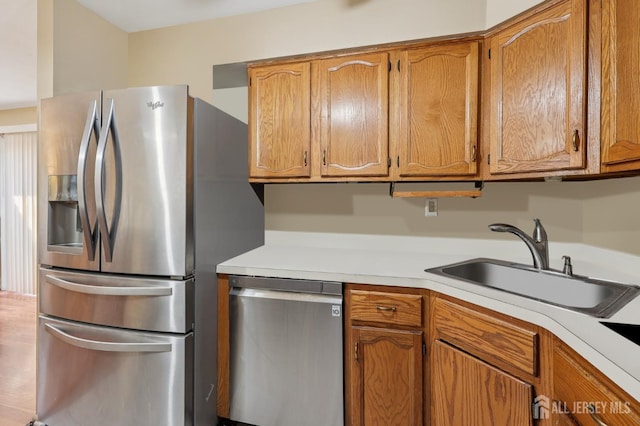 160 Goldmine Ln, Old Bridge, NJ 08857 - kitchen with stainless steel appliances, light countertops, and brown cabinetry