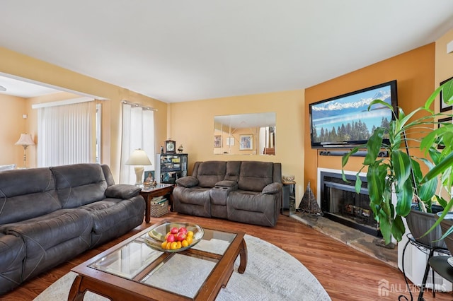 160 Goldmine Ln, Old Bridge, NJ 08857 - living area with wood finished floors, a fireplace with raised hearth, and healthy amount of natural light