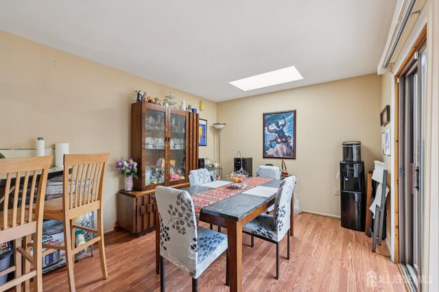 160 Goldmine Ln, Old Bridge, NJ 08857 - dining area featuring a skylight and light wood-style flooring