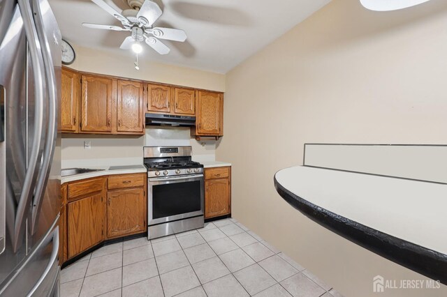 160 Goldmine Ln, Old Bridge, NJ 08857 - kitchen featuring stainless steel appliances, under cabinet range hood, a ceiling fan, light countertops, and brown cabinets