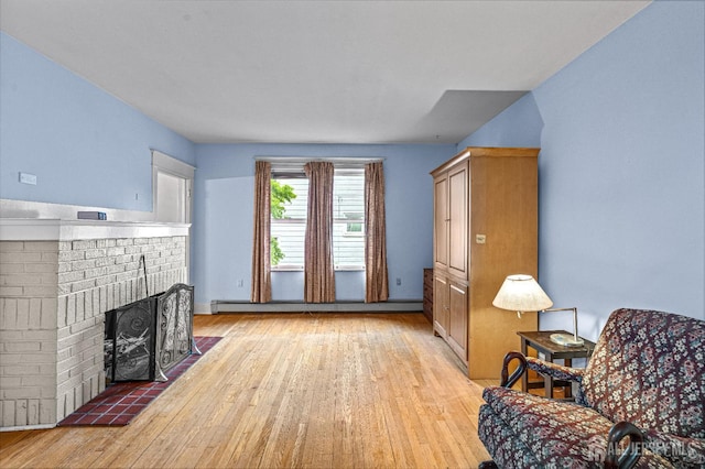 110 N 5th Ave N, Highland Park, NJ 08904 - living room featuring light wood-style floors, a fireplace, and baseboard heating