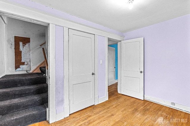 110 N 5th Ave N, Highland Park, NJ 08904 - staircase featuring wood finished floors and baseboards