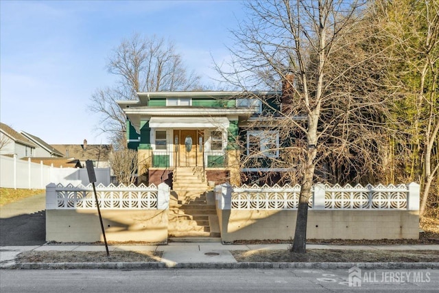 view of front of house with fence