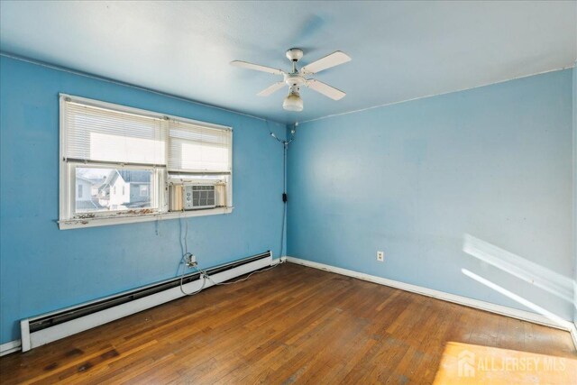 unfurnished room featuring ceiling fan, a baseboard radiator, cooling unit, and dark hardwood / wood-style flooring