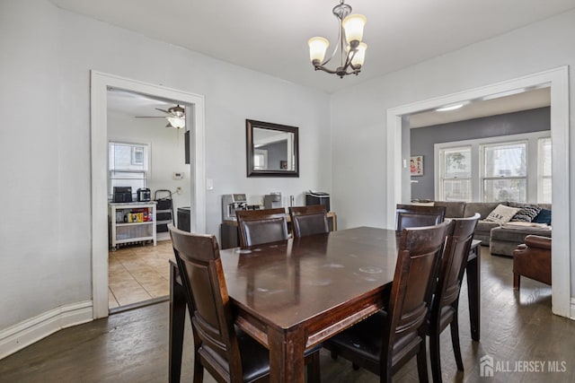 263 Bordentown Ave, South Amboy, NJ 08879 - dining room with healthy amount of natural light, dark wood-style floors, a chandelier, and ceiling fan