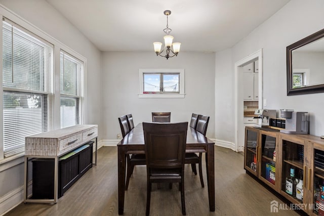 263 Bordentown Ave, South Amboy, NJ 08879 - dining area featuring dark wood finished floors and a chandelier