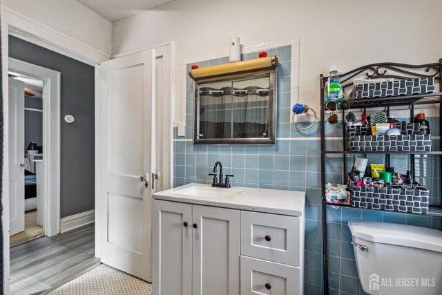 263 Bordentown Ave, South Amboy, NJ 08879 - bathroom featuring vanity and tile walls