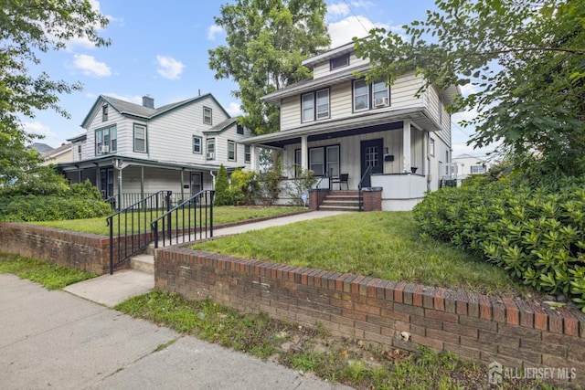 263 Bordentown Ave, South Amboy, NJ 08879 - traditional style home with covered porch, board and batten siding, a garage, and a front lawn