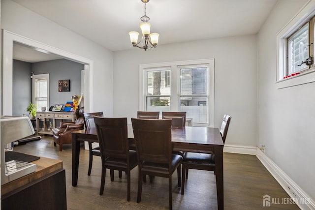 263 Bordentown Ave, South Amboy, NJ 08879 - dining room with a chandelier and dark wood-style flooring