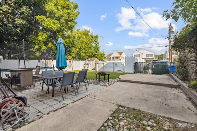 263 Bordentown Ave, South Amboy, NJ 08879 - fenced backyard with a patio, outdoor dining space, and a residential view