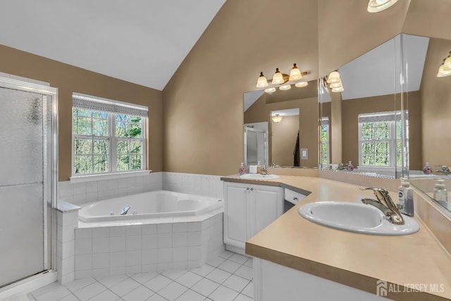 4 Angelina Ct, Monroe, NJ 08831 - full bathroom featuring tile patterned flooring, a stall shower, a garden tub, healthy amount of natural light, and high vaulted ceiling