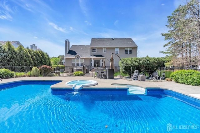4 Angelina Ct, Monroe, NJ 08831 - view of swimming pool with an in-ground hot tub and a patio area