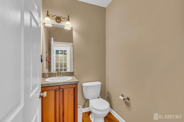 4 Angelina Ct, Monroe, NJ 08831 - bathroom featuring toilet, vanity, wood finished floors, and baseboards