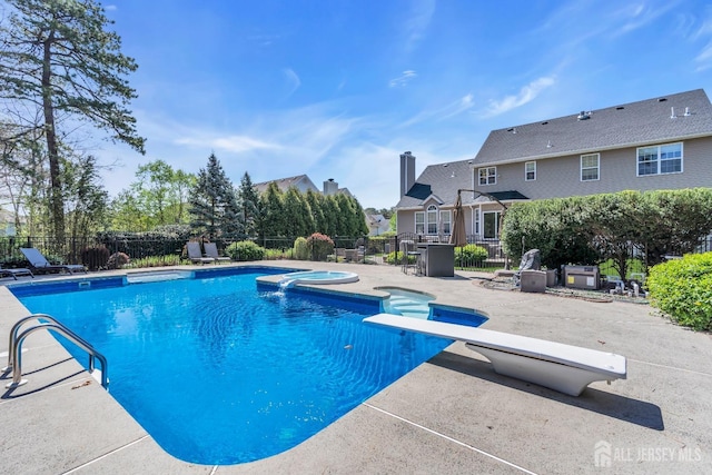 4 Angelina Ct, Monroe, NJ 08831 - view of swimming pool with a patio area, a diving board, and a pool with connected hot tub