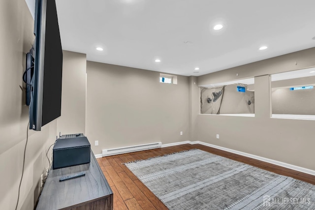 4 Angelina Ct, Monroe, NJ 08831 - basement with baseboard heating, hardwood / wood-style floors, baseboards, and recessed lighting