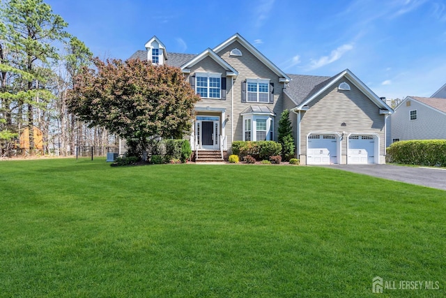 4 Angelina Ct, Monroe, NJ 08831 - view of front of house featuring a front yard, driveway, and an attached garage