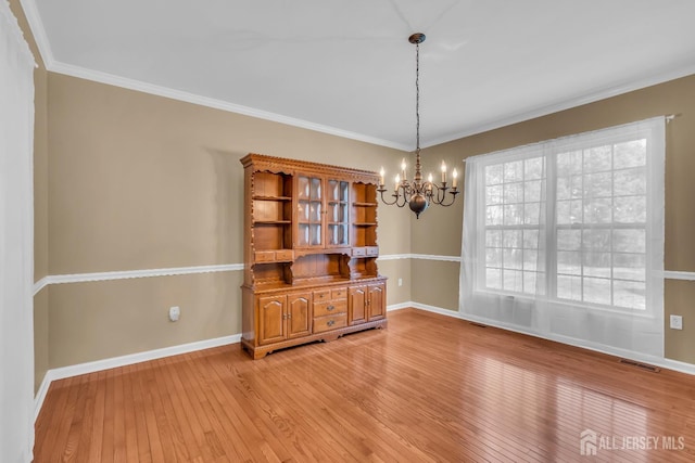 4 Angelina Ct, Monroe, NJ 08831 - spare room featuring a chandelier, light wood-type flooring, baseboards, and ornamental molding