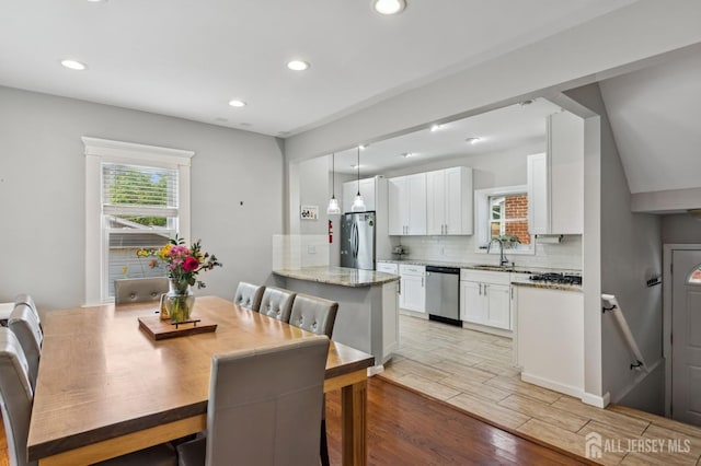 147 Grove Ave, Woodbridge Proper, NJ 07095 - dining area featuring light wood finished floors and recessed lighting
