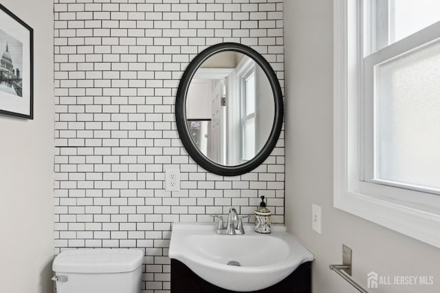 147 Grove Ave, Woodbridge Proper, NJ 07095 - bathroom with healthy amount of natural light, vanity, and tasteful backsplash