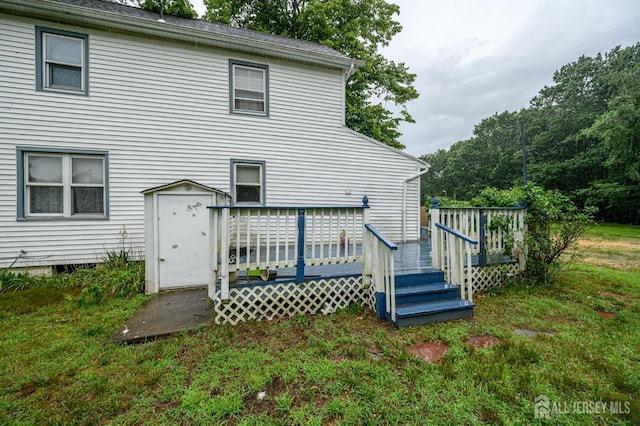 45 Lake Ave, Helmetta, NJ 08828 - back of house with a wooden deck, a storage shed, and a yard