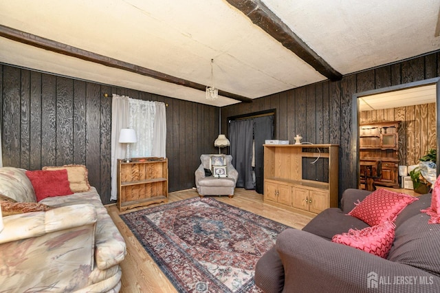 45 Lake Ave, Helmetta, NJ 08828 - living area with beamed ceiling, wooden walls, and wood finished floors