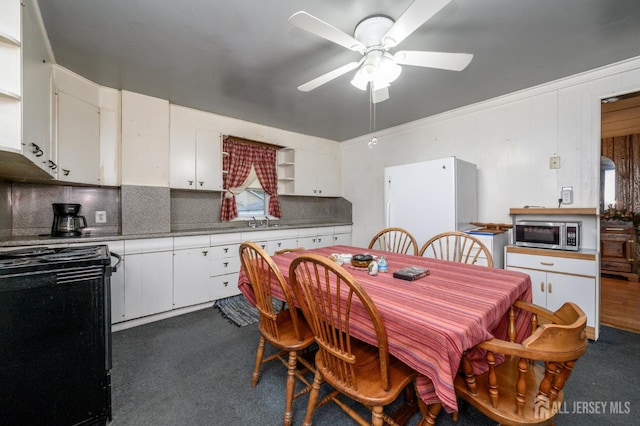 45 Lake Ave, Helmetta, NJ 08828 - dining room featuring ceiling fan and dark carpet
