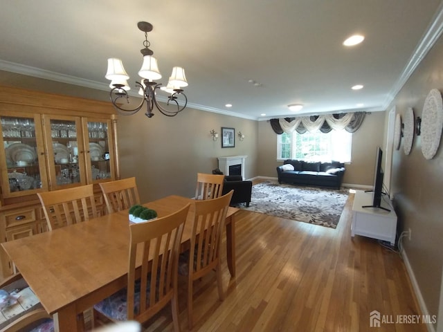 18 Timber Rd, East Brunswick, NJ 08816 - dining room featuring baseboards, wood finished floors, ornamental molding, a chandelier, and recessed lighting