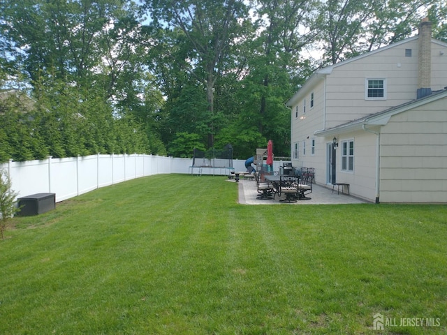 18 Timber Rd, East Brunswick, NJ 08816 - view of yard with a trampoline and a patio