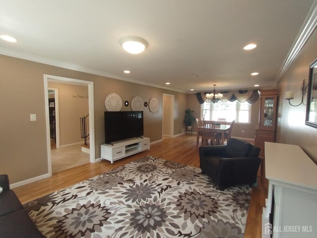 18 Timber Rd, East Brunswick, NJ 08816 - living area featuring a chandelier, recessed lighting, ornamental molding, wood finished floors, and baseboards