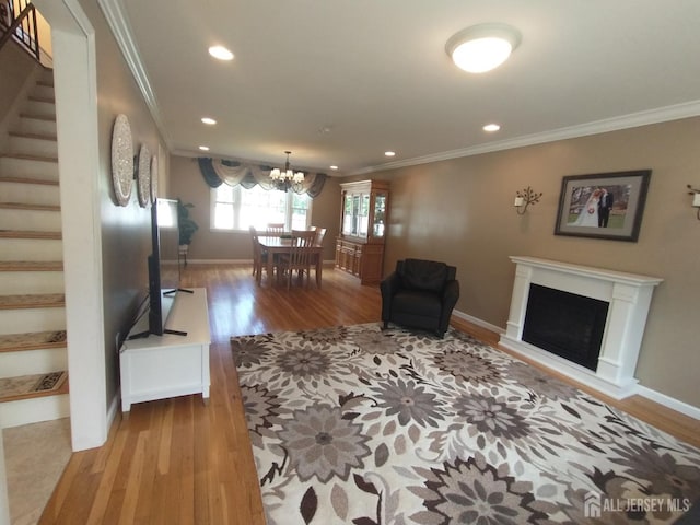 18 Timber Rd, East Brunswick, NJ 08816 - living room with stairs, crown molding, wood finished floors, a chandelier, and recessed lighting