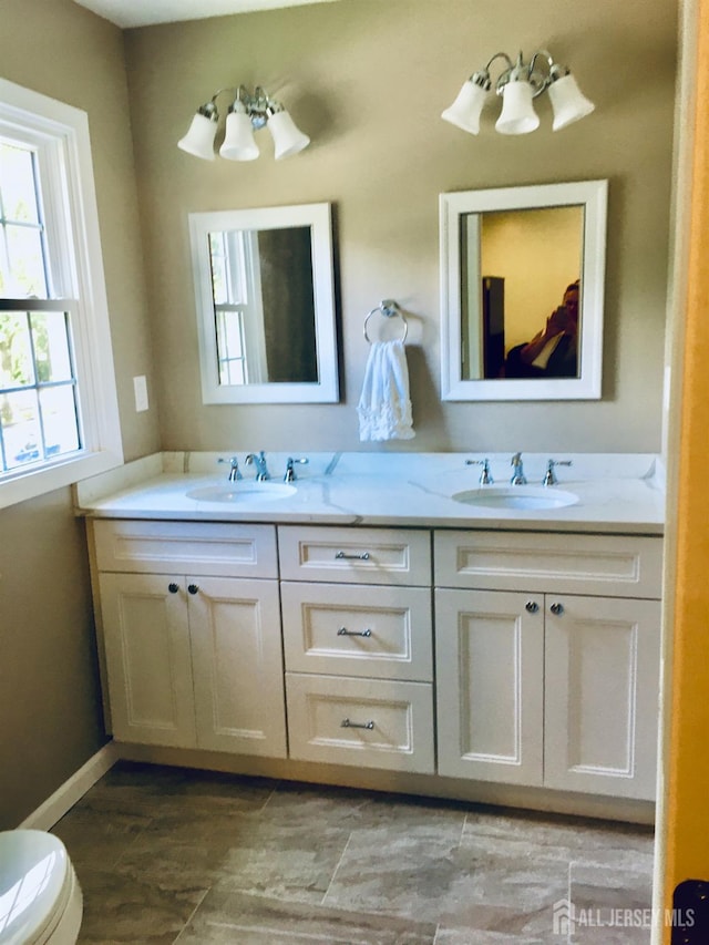 18 Timber Rd, East Brunswick, NJ 08816 - full bath with double vanity, toilet, and baseboards