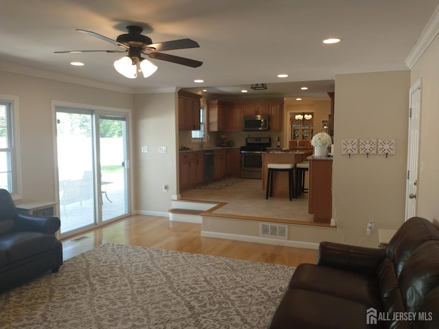 18 Timber Rd, East Brunswick, NJ 08816 - living room with light wood-style flooring, a ceiling fan, ornamental molding, recessed lighting, and baseboards
