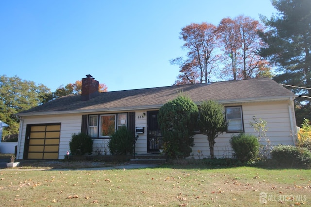 ranch-style house with a garage and a front yard