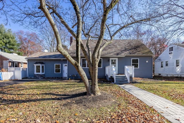 single story home featuring a front yard