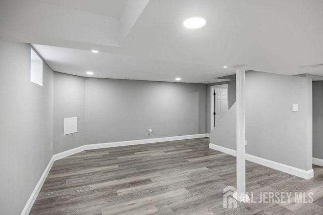 basement featuring hardwood / wood-style floors