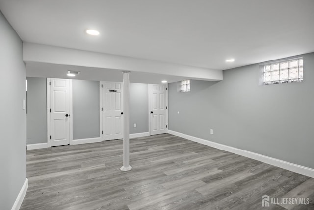 basement featuring light wood-type flooring